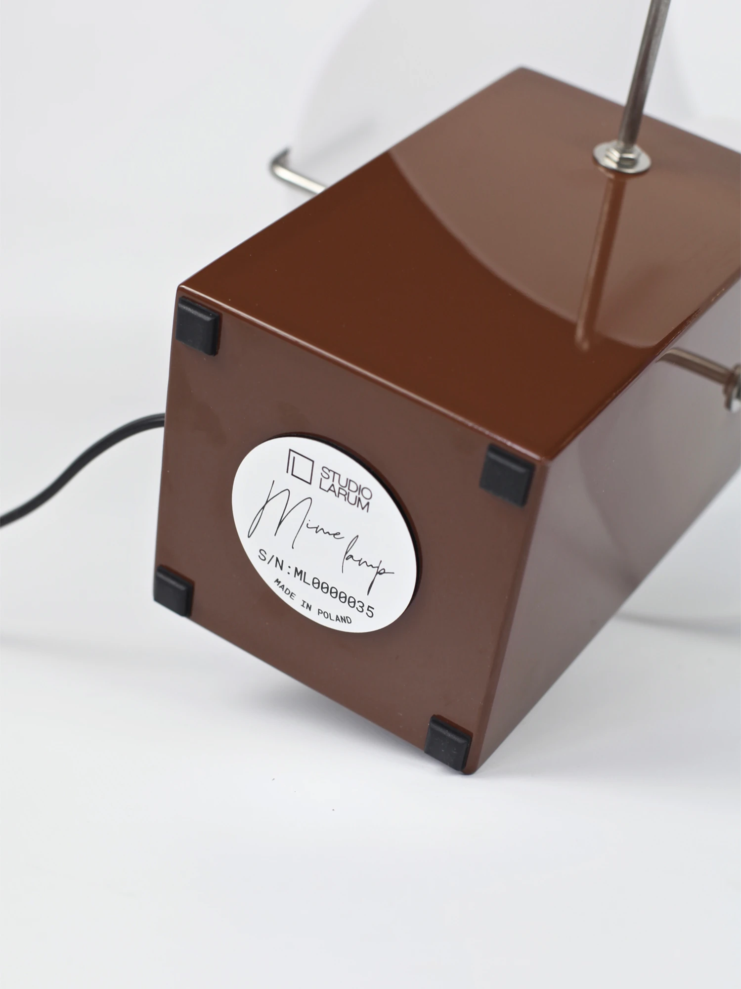 a brown box with a black wire